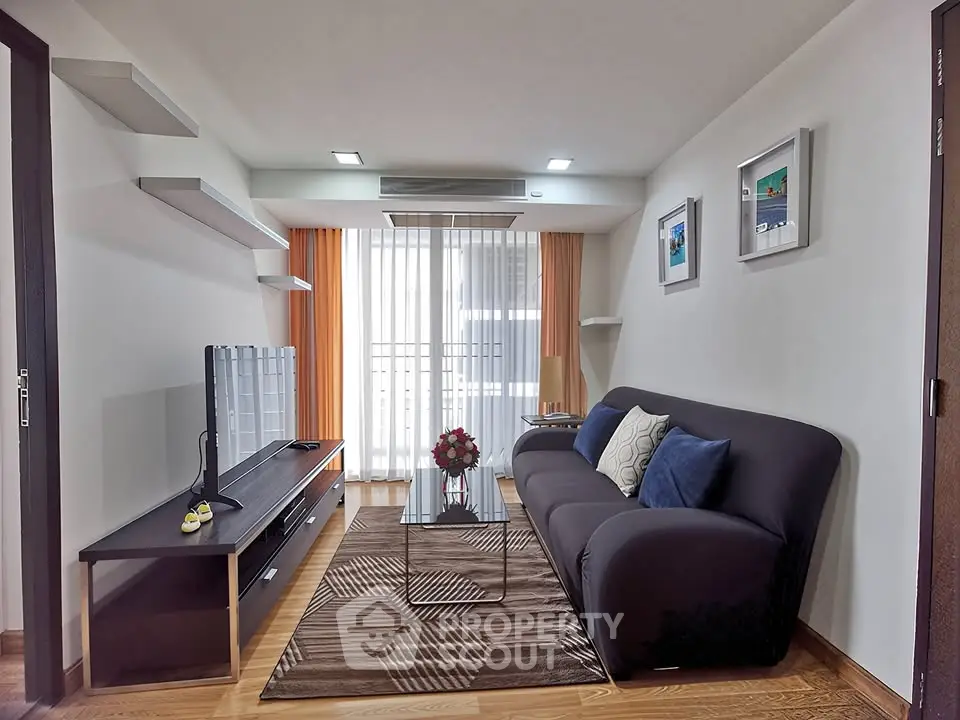 Modern living room with sleek furniture and natural light