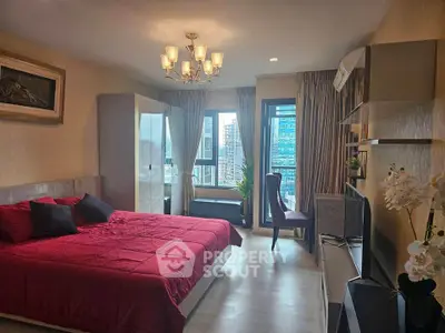 Luxurious bedroom with city view, elegant decor, and modern furnishings in a high-rise apartment.
