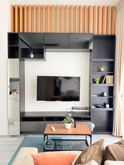 Modern living room with sleek TV unit and cozy decor