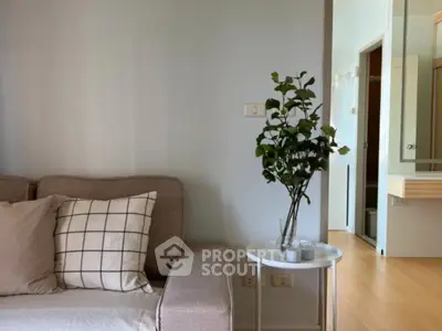 Modern living room with cozy sofa and stylish decor