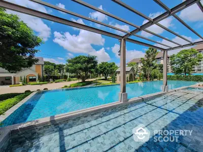 Luxurious infinity pool with stunning garden view in modern residential complex