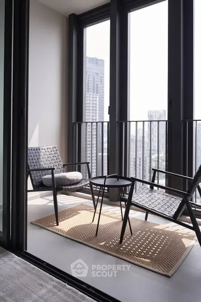 Modern balcony with stylish furniture and city view, perfect for relaxation and urban living.