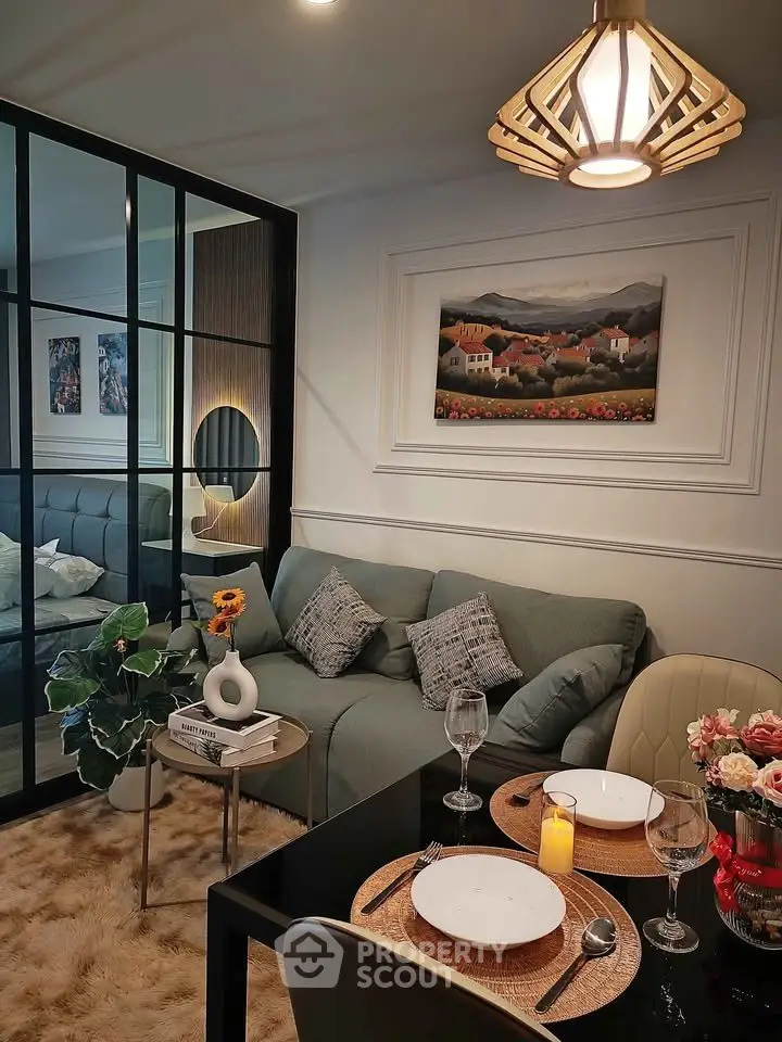 Stylish living room with cozy dining area and elegant decor in modern apartment.