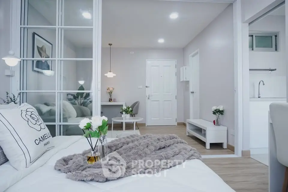 Modern bedroom with stylish decor and cozy ambiance in a contemporary apartment.