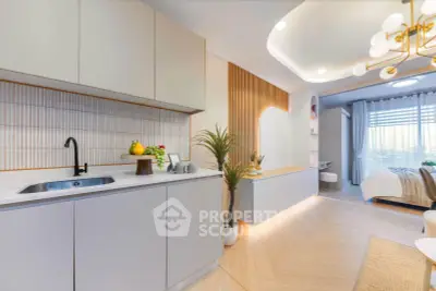 Modern open-layout kitchen with sleek cabinetry and cozy bedroom view