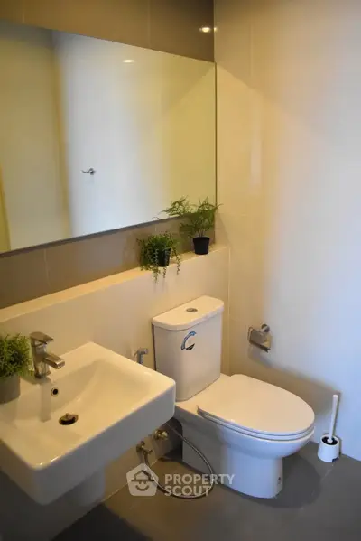 Modern bathroom with sleek fixtures and minimalist design, perfect for contemporary living.