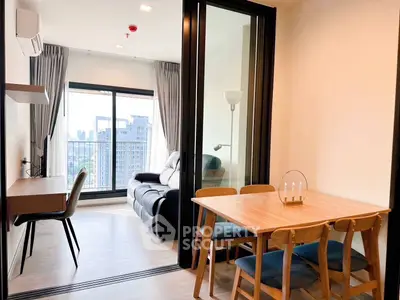 Modern apartment with open living and dining area featuring city view.