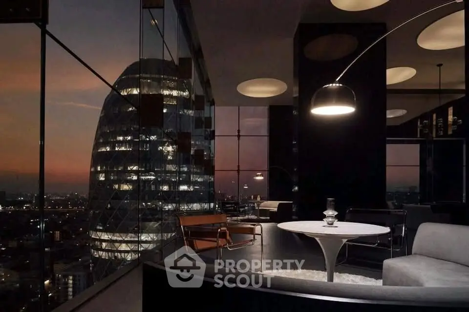 Luxurious modern living room with stunning cityscape view and elegant furnishings.