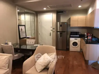 Modern apartment interior with open kitchen and cozy living area