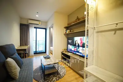 Modern living room with balcony access and stylish decor in a cozy apartment.