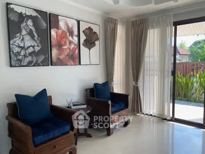 Elegant living room with stylish decor and natural light, featuring cozy seating and garden view.