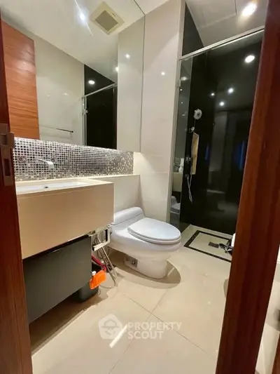 Modern bathroom with sleek design and glass shower enclosure