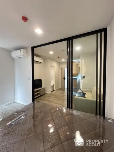 Modern apartment interior with glass partition and air conditioning