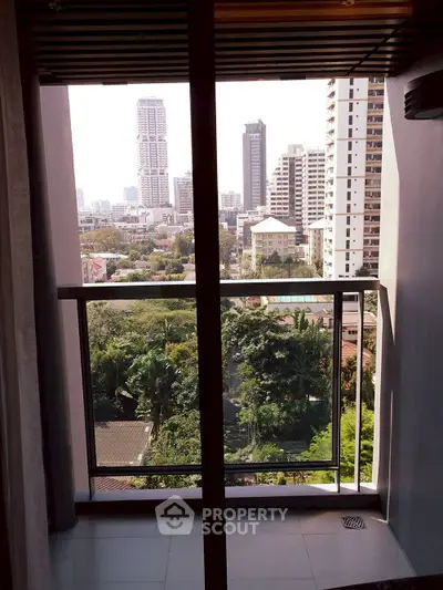 Stunning cityscape view from a modern apartment balcony, showcasing urban living at its finest.