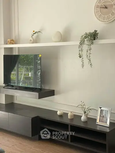 Stylish living room with modern TV unit and decorative shelves