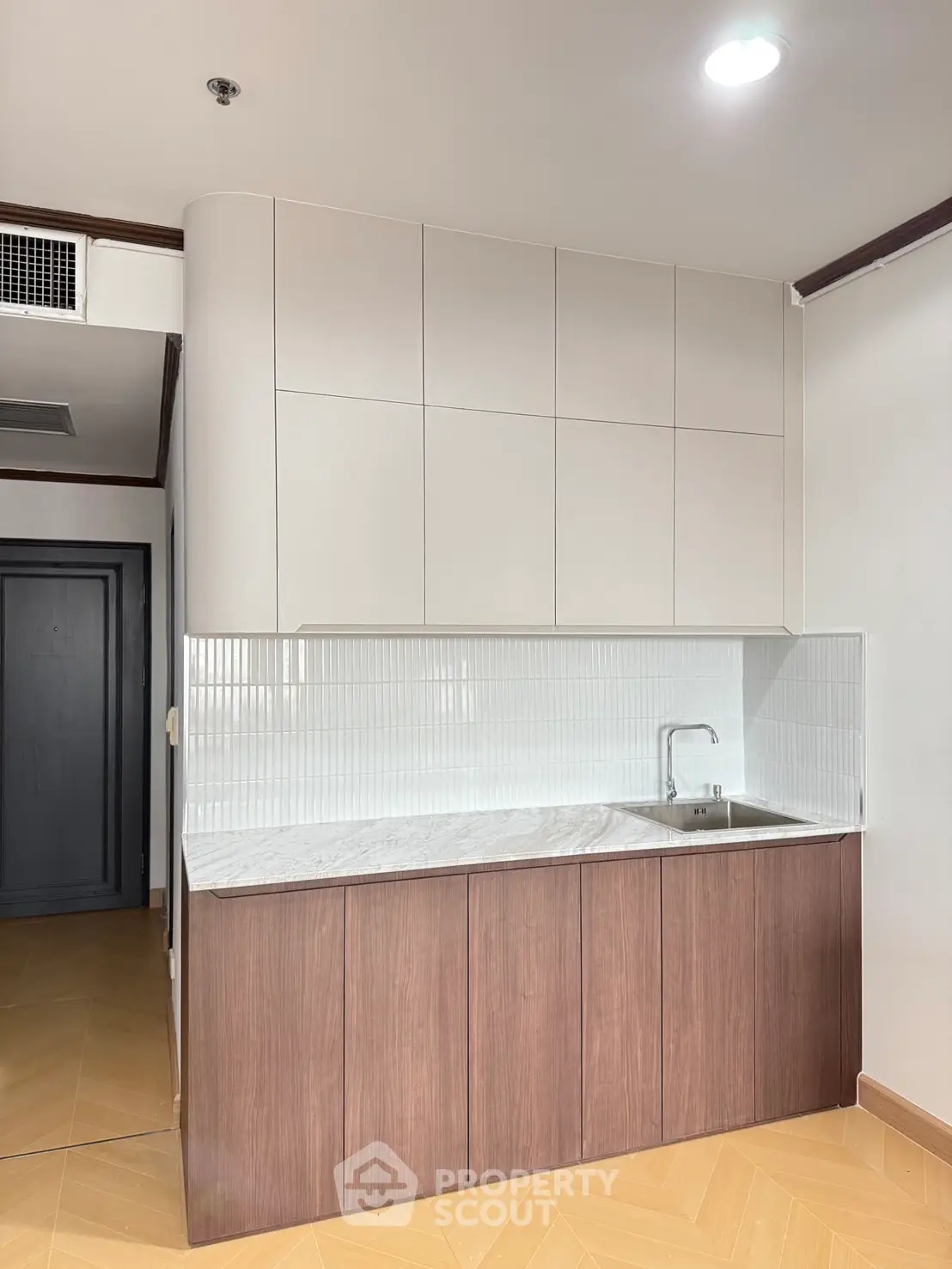 Modern kitchen with sleek cabinetry and minimalist design