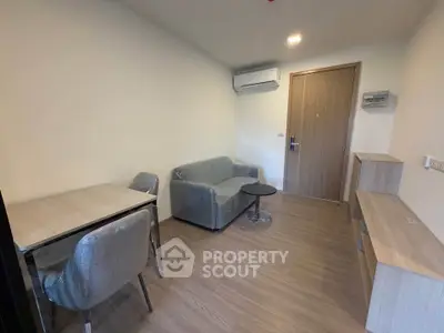 Modern living room with sleek furniture and air conditioning in a cozy apartment.