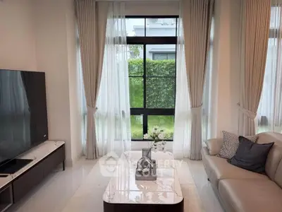 Elegant living room with large windows and modern decor