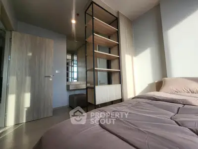 Modern bedroom with stylish shelving and natural light