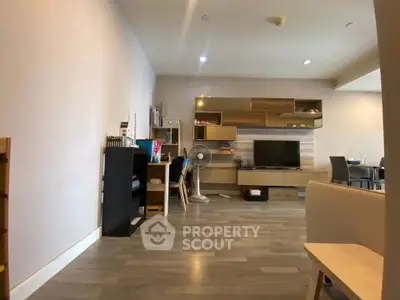 Spacious modern living room with stylish shelving and cozy seating area.