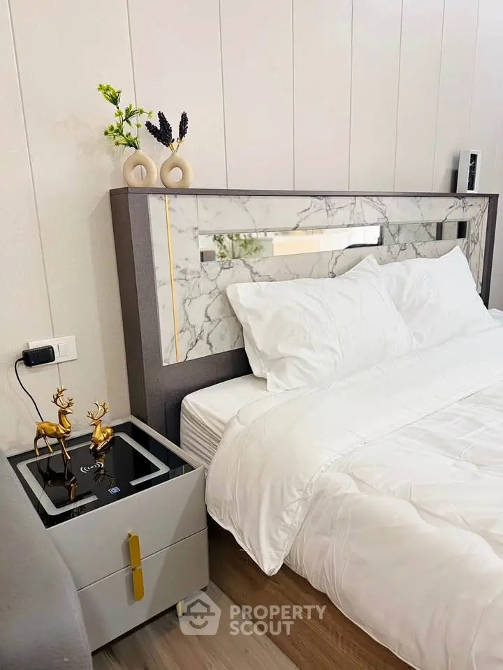 Luxurious bedroom with elegant decor and modern bedside table