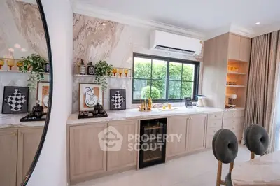 Stylish modern kitchen with elegant cabinetry and large window view