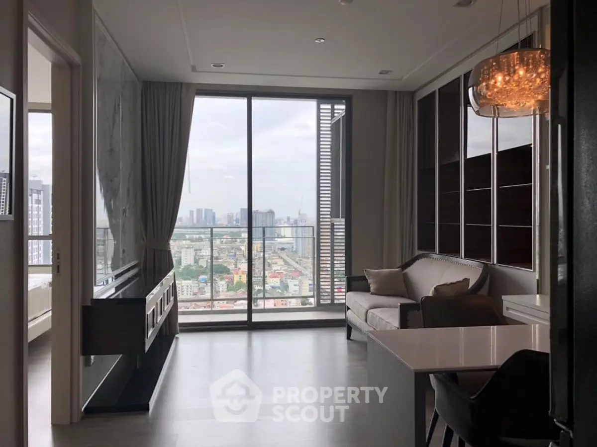 Modern living room with city view and elegant chandelier
