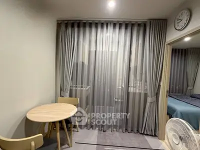 Cozy apartment interior with dining area and bedroom view