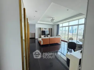 Spacious modern living room with city view and elegant furnishings