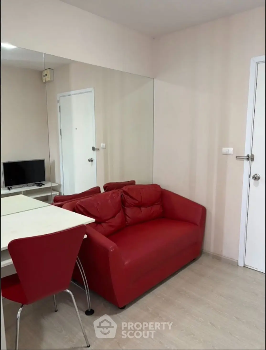Cozy living room with red sofa and modern decor