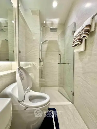 Modern bathroom with sleek shower and elegant tile design, perfect for a luxurious home experience.