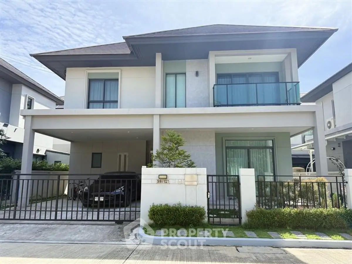 Modern two-story house with sleek design and spacious driveway