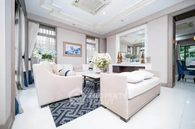 Luxurious living room with elegant decor and plush seating in a modern home.
