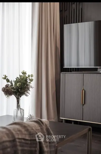 Elegant living room with modern decor and sleek TV stand