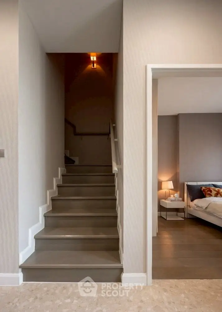 Modern interior with staircase and cozy bedroom view
