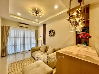 Elegant living room with modern lighting and cozy seating area