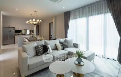 Luxurious modern living room with elegant decor and open kitchen layout