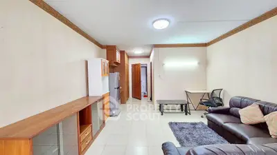 Spacious living room with modern furniture and ample natural light