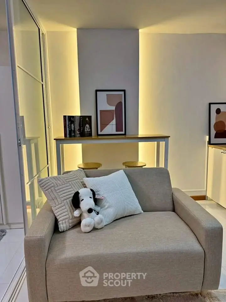 Cozy living room with modern decor and plush seating, perfect for relaxation and entertaining.