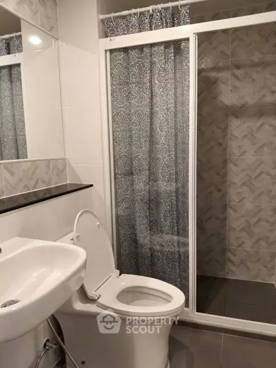 Modern bathroom with shower and toilet in sleek design