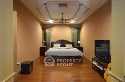 Luxurious bedroom with elegant decor and wooden flooring