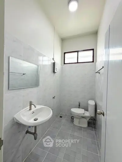 Spacious bathroom with modern fixtures and natural light