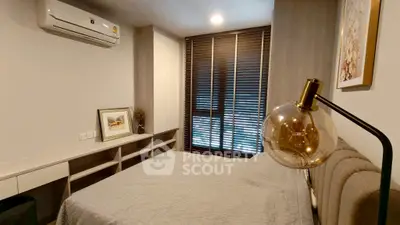 Modern bedroom with stylish decor and ample natural light