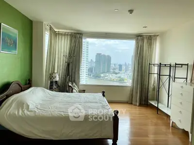 Spacious bedroom with stunning city view and elegant decor