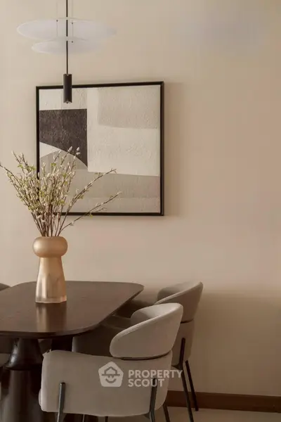 Elegant dining area with modern decor and stylish chairs, perfect for sophisticated gatherings.