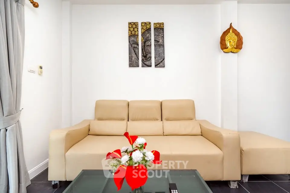 Modern living room with beige sofa and artistic wall decor