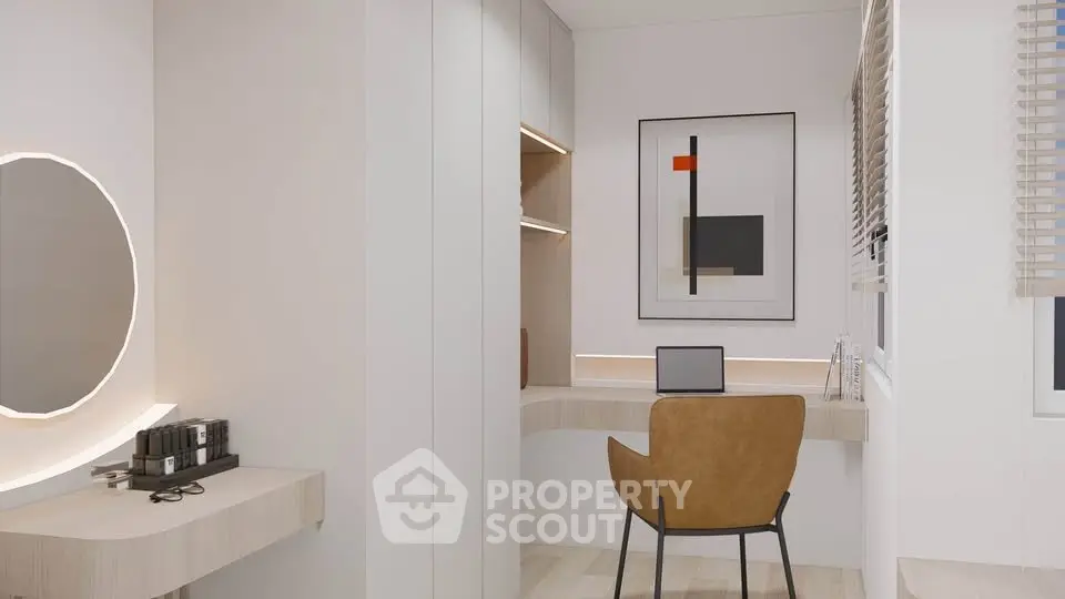 Modern study room with sleek desk, stylish chair, and contemporary wall art.