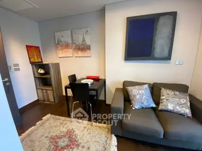 Cozy living room with modern decor and comfortable seating in a stylish apartment.