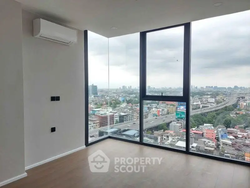 Spacious corner unit with panoramic city view and modern interior design.