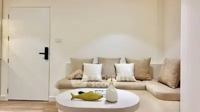 Modern minimalist living room with cozy seating and stylish decor